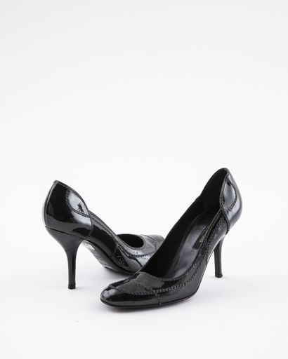 null SERGIO ROSSI: a pair of black patent leather pumps, S.38 Ht. Heel 9.5 and a...