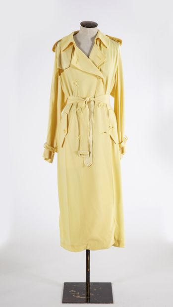 null DKNY: Yellow polyester trench coat with notched collar, double-breasted button...