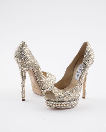 null JIMMY CHOO: Platform shoes in gold-tone leather dotted with Swarovski rhinestones,...