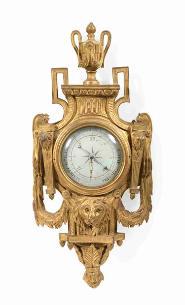 null Barometer in gilded wood carved of a lion's head, the dial inscribed in a shield...