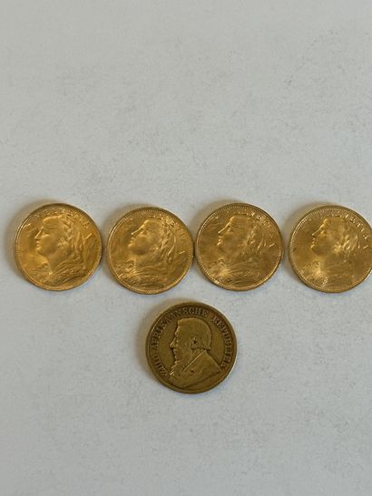 null 18 Lot of four 20 Swiss Francs gold coins and one gold coin from South Afri...
