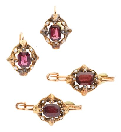 null 46 Set in yellow gold (750) set with garnets or red stones in rose-cut diamonds...
