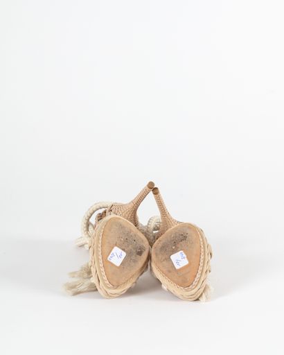 null DIOR : a pair of open sandals made of natural reticulated python and beige braided...