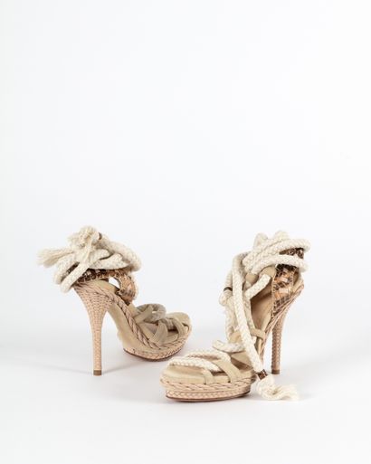 null DIOR : a pair of open sandals made of natural reticulated python and beige braided...