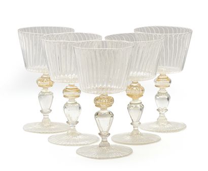null Suite of five Venetian-style blown glass stemmed glasses. Height: 17 cm