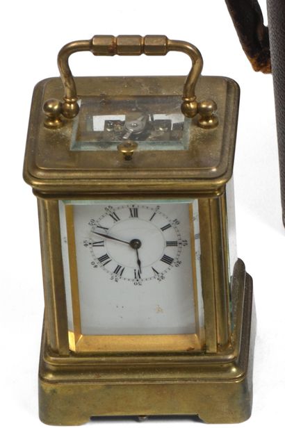 null Travelling cage clock, also known as an officer's clock, in brass, beveled glass...