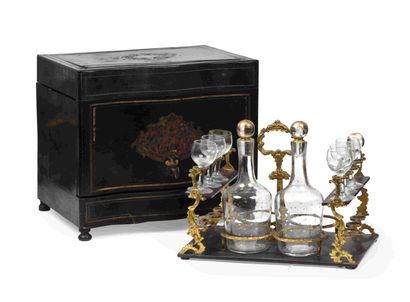 null Liqueur cellar in blackened wood inlaid with tortoiseshell and brass. The mobile...
