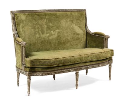 null Sofa in cream lacquered wood carved with water-leaf and pearl friezes. The detached...