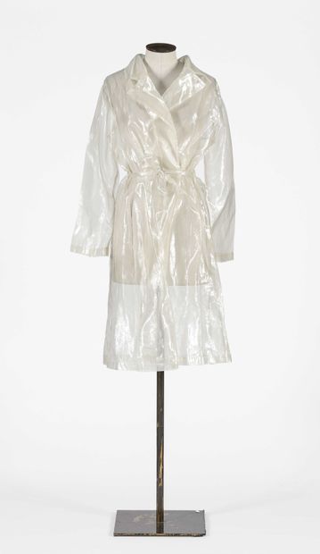 null PILAR SALVADO: Raincoat in transparent white plastic and silk. Long sleeves,...