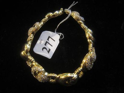 null Bracelet gourmette en or jaune (750) à motif de huit scarabées dont quatre chacun...