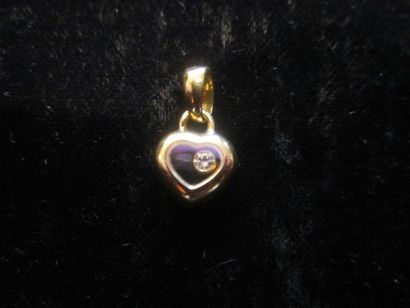 null Chaîne et son pendentif en or jaune (750) en forme de coeur orné d'un diamant...