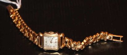null Montre de femme en or (18 k) jaune, bracelet souple à motif de fleurettes. Poids...