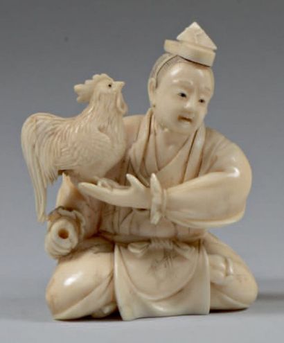 JAPON - Epoque MEIJI (1868 - 1912) 
Okimono en dent d'hippopotame, personnage assis...