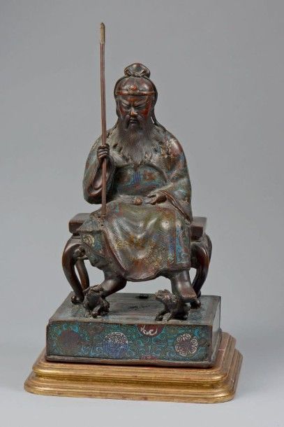 JAPON - Epoque MEIJI (1868 - 1912) 
Statuette de personnage assis en bronze à patine...