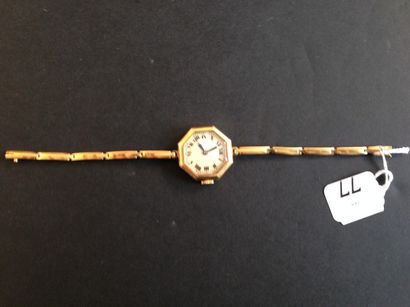 null Petite montre de dame octogonal et bracelet articulé en or jaune 18K (750).

Poids...