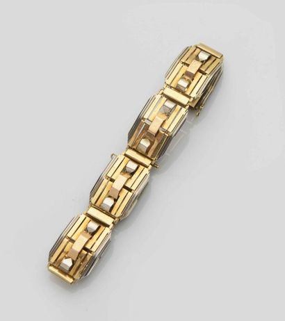 null Bracelet à plaquettes  ajourées à pans  en or jaune et or gris 18 ct (750)
Vers...