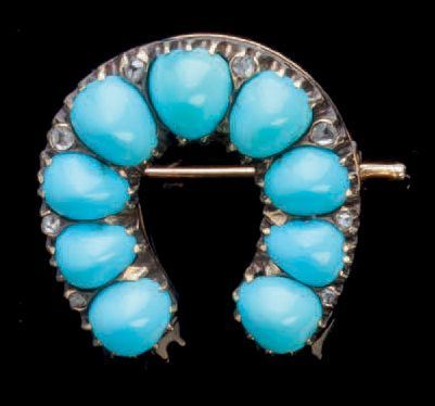 null Belle broche en or 583 millièmes en forme de fer à cheval, sertie de 9 cabochons...