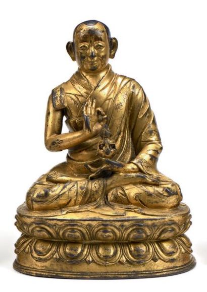 null Lama en bronze doré
Tibet.
Hauteur: 28 cm