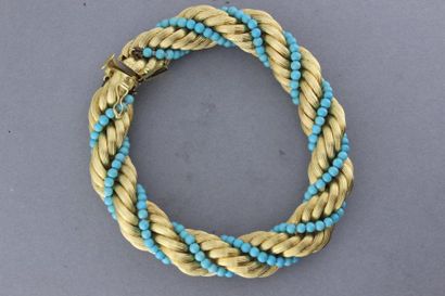 null Bracelet "Twist" en or torsadé de turquoises. Poids : 67,1g