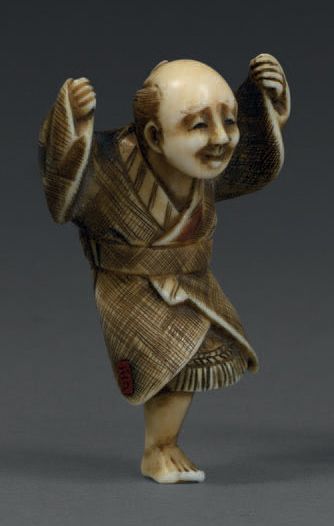 null Netsuke en ivoire représentant un personnage sautant.
Signé.
Japon, XIXe siècle.
Hauteur:...