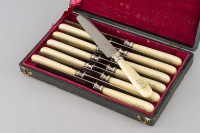 null A series of twelve table knives, the handles in monogrammed ivory "BB". Silver...