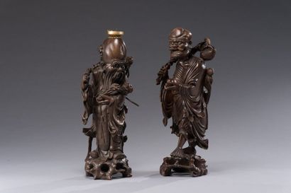 CHINE Ebisu, God of Prosperity in carved exotic wood depicted standing and smiling.
Qing...