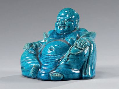 CHINE Laughing Buddha known as "putai" in turquoise blue enamelled porcelain, represented...