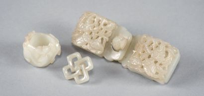 CHINE Celadon jade set including a belt buckle with openwork decoration, an archer's...