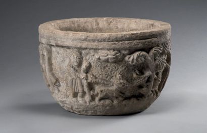 null *Large carved stone basin decorated with characters and animals in the Romanesque...