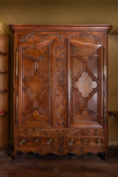 null Walnut and oak cabinet with moulded and carved decoration, opening with two...