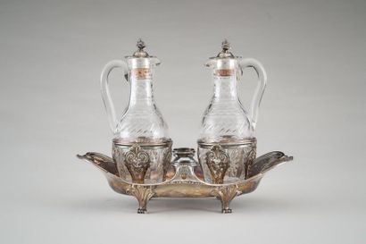 null Oil and vinegar holder in silver (950/1000e) with a fretwork shape and foliage...