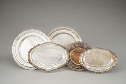 null Lot in silver plated metal including two large round dishes a round plate and...