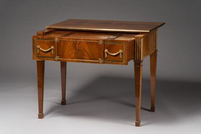 null Table with a mahogany mechanism and flamed mahogany veneer, the sliding top...