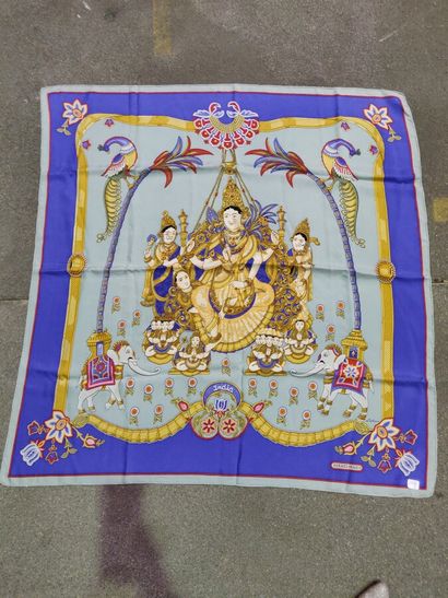 null A blue HERMES square scarf entitled "India" in the lower centre, signed "He...