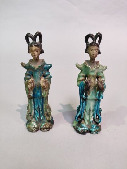 null CHINA:

Two blue-green enamelled earthenware pendant statuettes representing...