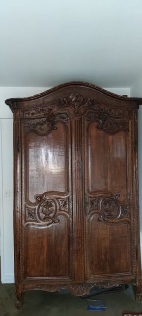 null Two-door cupboard in oak carved with flowers and doves.

Rouennais work from...