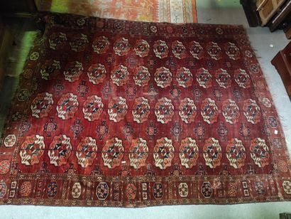 null Bukhara carpet with classic pattern on a red background.

238 x 190 cm.