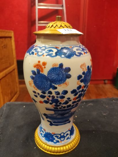 null CHINA: Porcelain baluster vase with polychrome decoration of flowering vases....