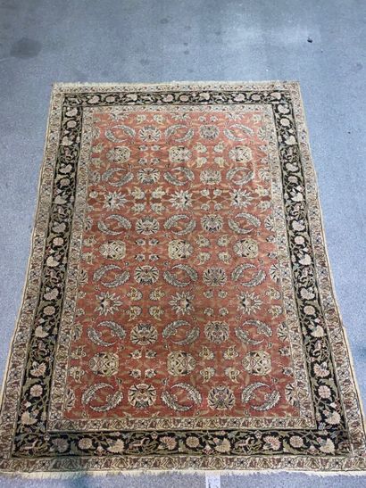 null Rectangular carpet decorated with cashmere motifs on a salmon background. Eyelet...