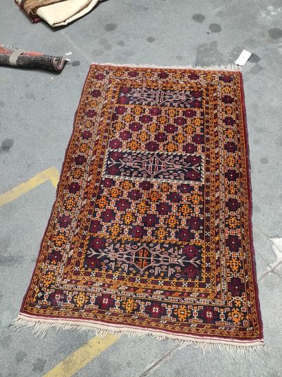 null Oriental carpet with stylized floral pattern in brick and red. Wear. 136 x 87...