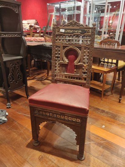 null Natural wood chair with openwork decoration, the back decorated with an inscription...
