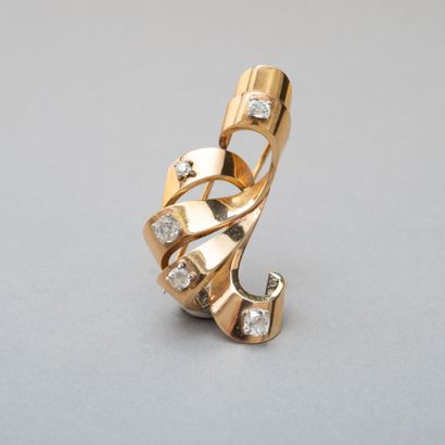 null 119. Yellow gold 750/1000th and platinum volute lapel clip

accented with five...