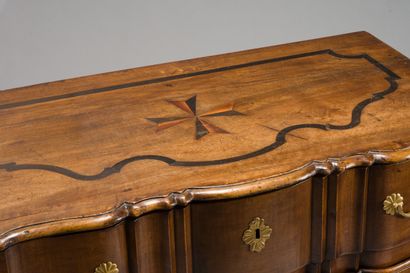 null 190. walnut chest of drawers with a crossbow front, decorated with a

of a Maltese...