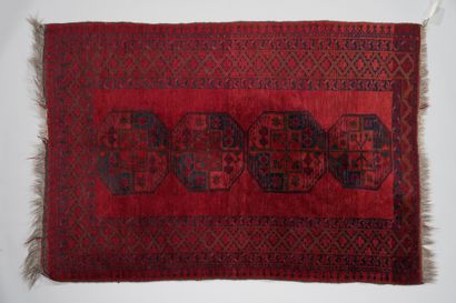 null 259. BOUKHARA

Carpet with four central medallions, classical design

on a red...