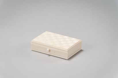 null Rectangular ivory box, the lid carved with a checkerboard.

Signed on the lock...