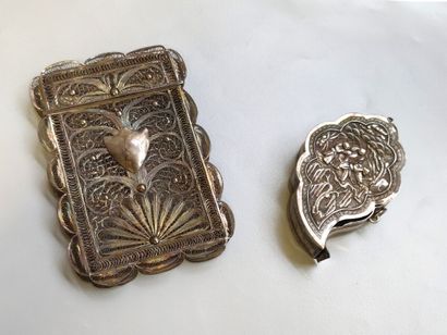 null Lot including a silver box in the shape of a vine leaf with characters in a...