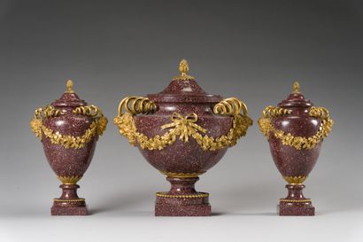 null 80. Egyptian porphyry and gilt bronze set comprising a pair of baluster vases...