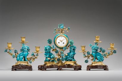 null 91. A turquoise blue porcelain and gilt bronze mantel set comprising a clock...