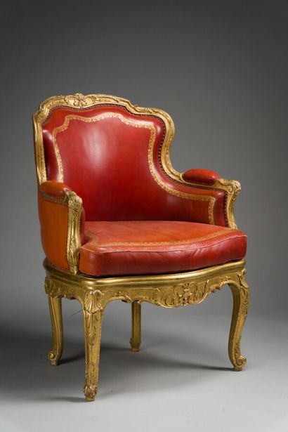 null 
85. Office armchair with cabriolet back in finely molded, carved and gilded...