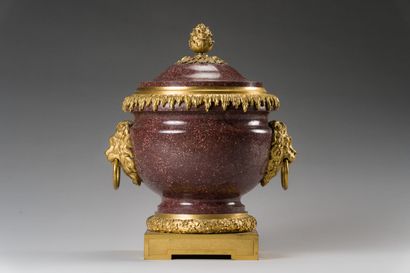 null 
84. Important pot and its lid in Egyptian porphyry, the frame in chased and...